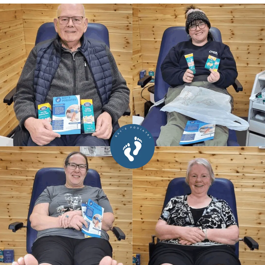 Four patients holding foot care leaflets in the treatment chair